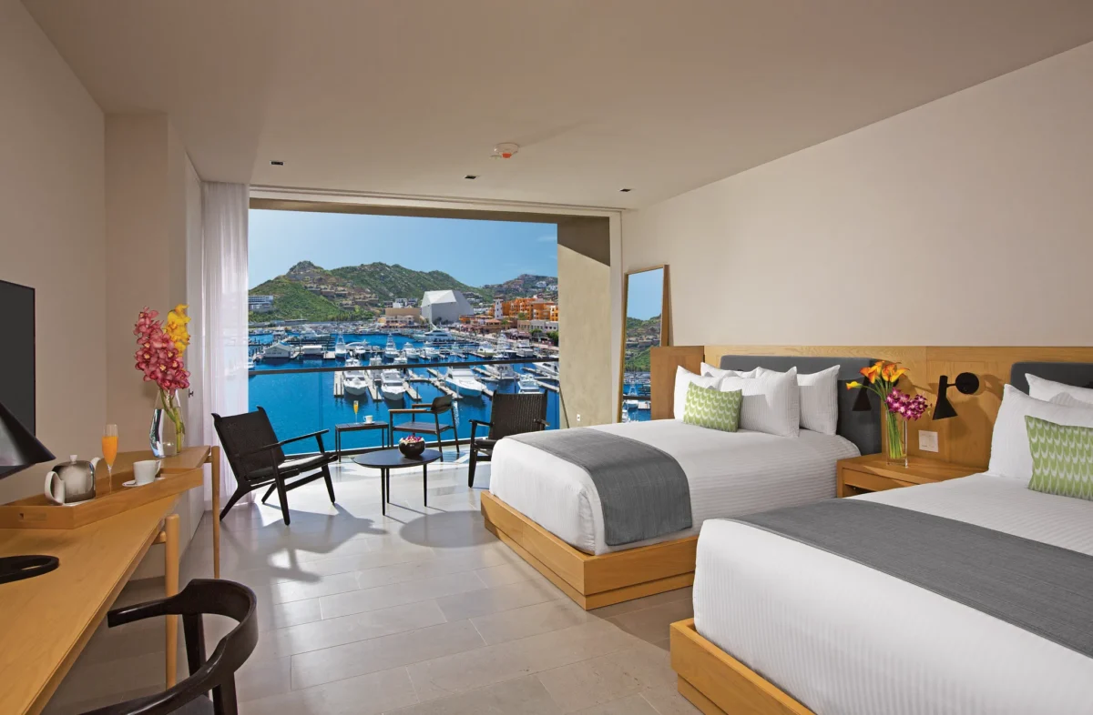 Spacious Allure Suite Marina View with two beds overlooking Cabo San Lucas Marina at Breathless Resort.