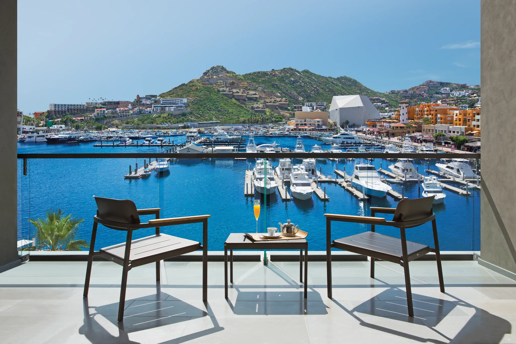 Private terrace overlooking the Cabo San Lucas Marina from the Allure Suite Marina View at Breathless Resort.