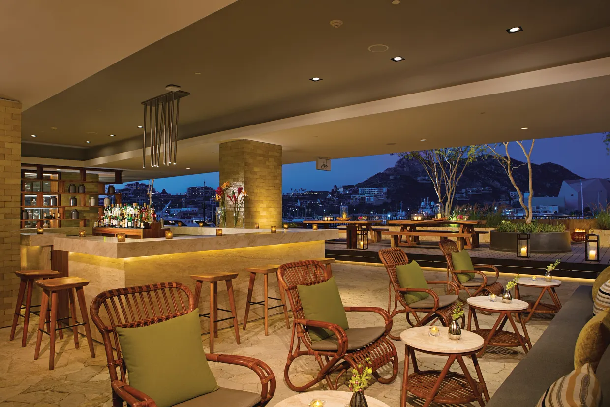 Wink Bar evening lounge with ambient lighting and marina views at Breathless Cabo San Lucas.