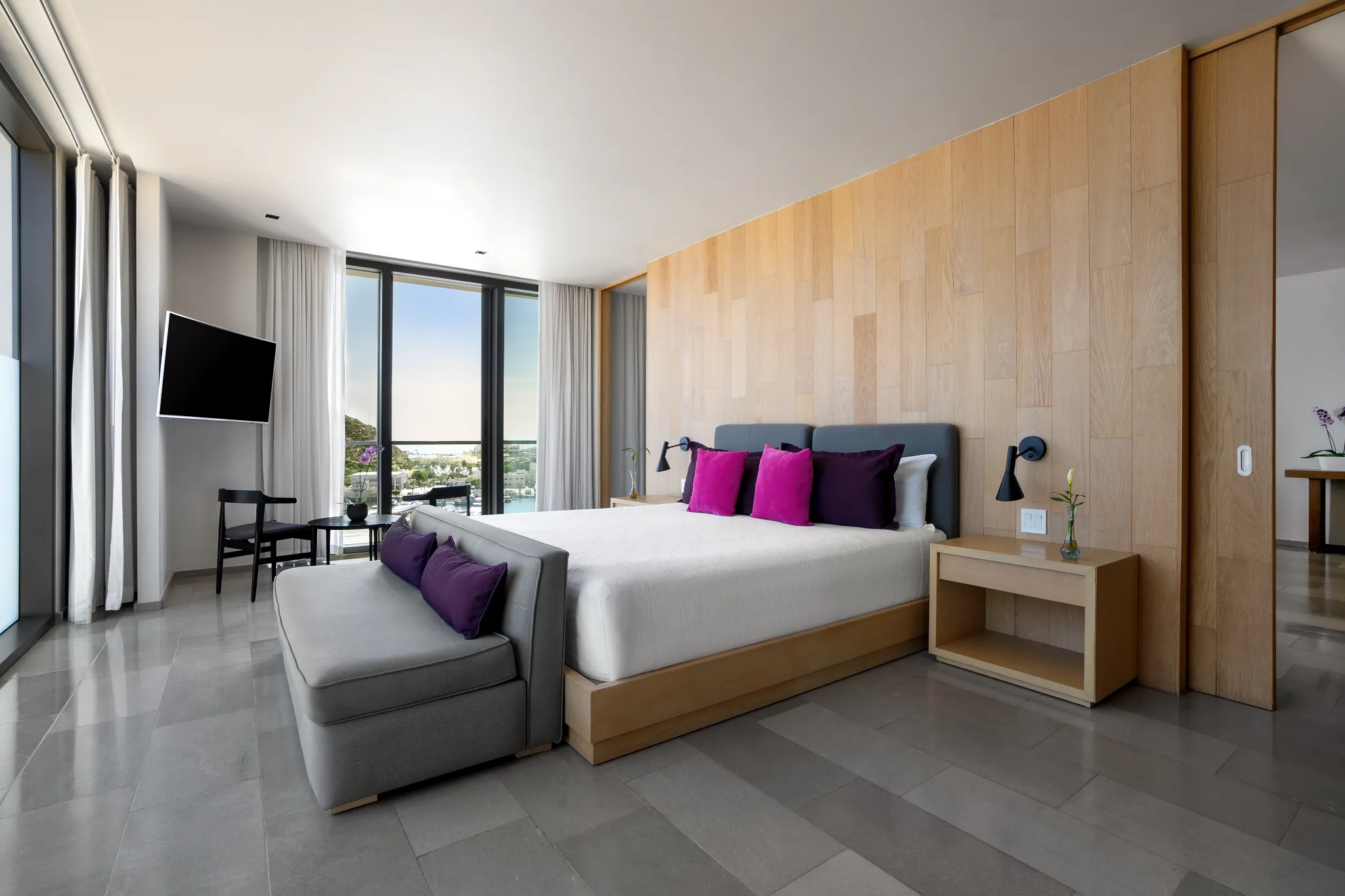 Spacious king bedroom with bright ocean views in the Xhale Club Master One Bedroom Suite at Breathless Cabo San Lucas.