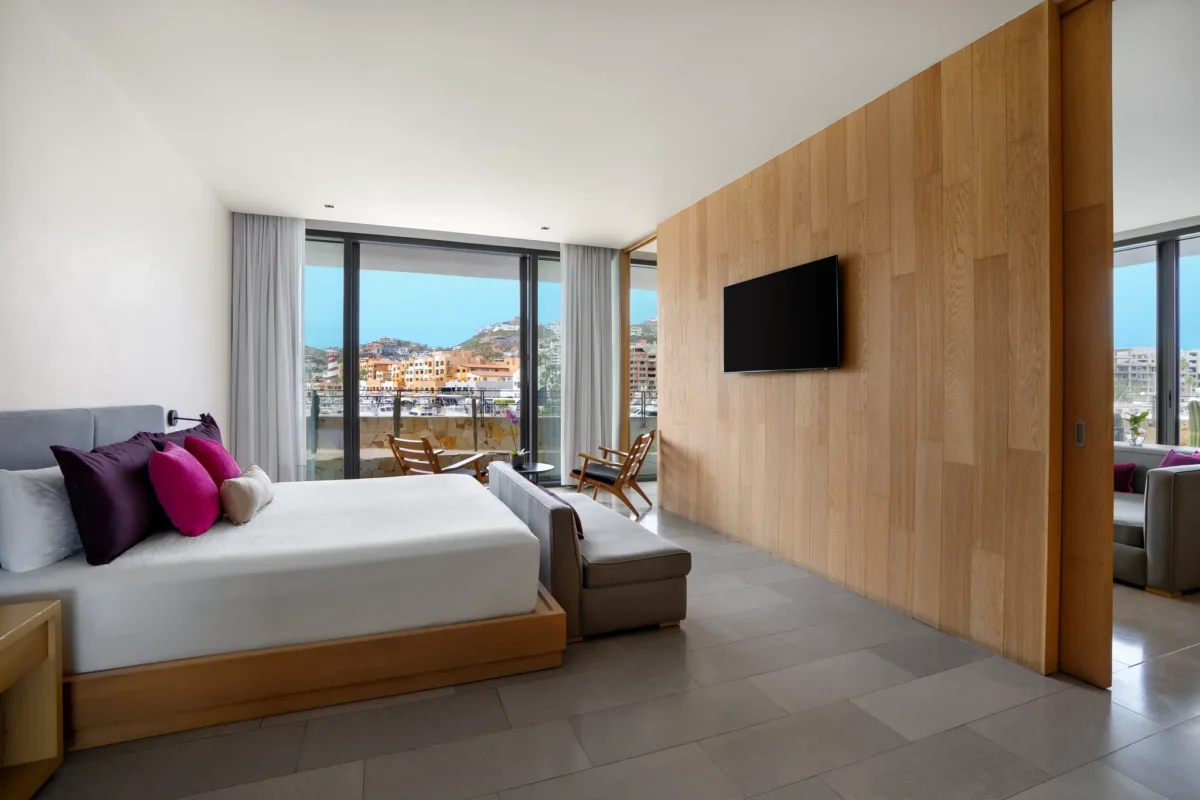 Spacious bedroom with marina views in the Xhale Club Master Suite Marina View at Breathless Cabo San Lucas.