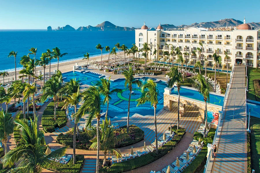 Riu Palace Cabo San Lucas beachfront resort with mosaic pool and panoramic views of Land’s End.
